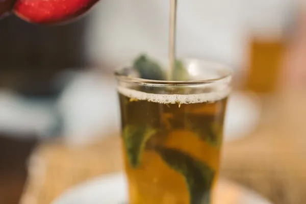 Close view of a glass of Moroccan mint tea